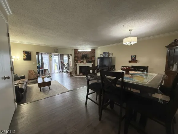 a living room with furniture flat screen tv and a fireplace