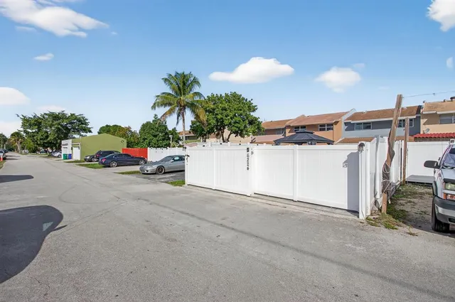 a view of a swimming pool with a chair and tables