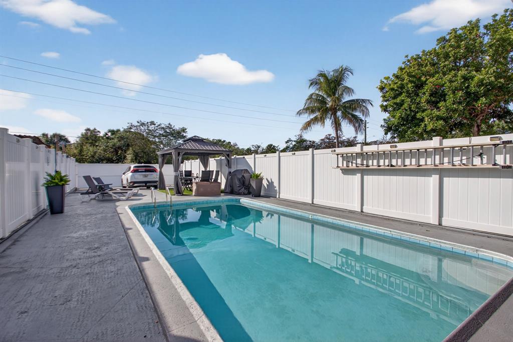 6224 Southwest 7th Street Margate, FL 33068 - Photo 16 of 51 a view of a house with a swimming pool