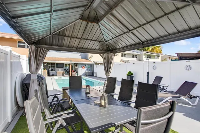 a view of a livingroom with furniture and a flat screen tv