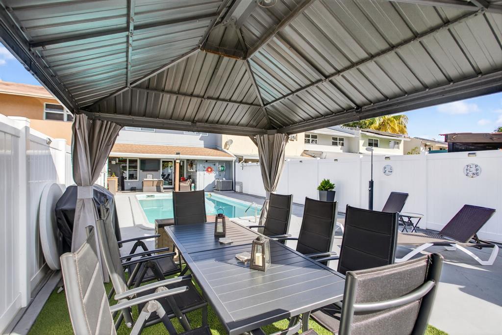 6224 Southwest 7th Street Margate, FL 33068 - Photo 21 of 51 a view of a patio with table and chairs