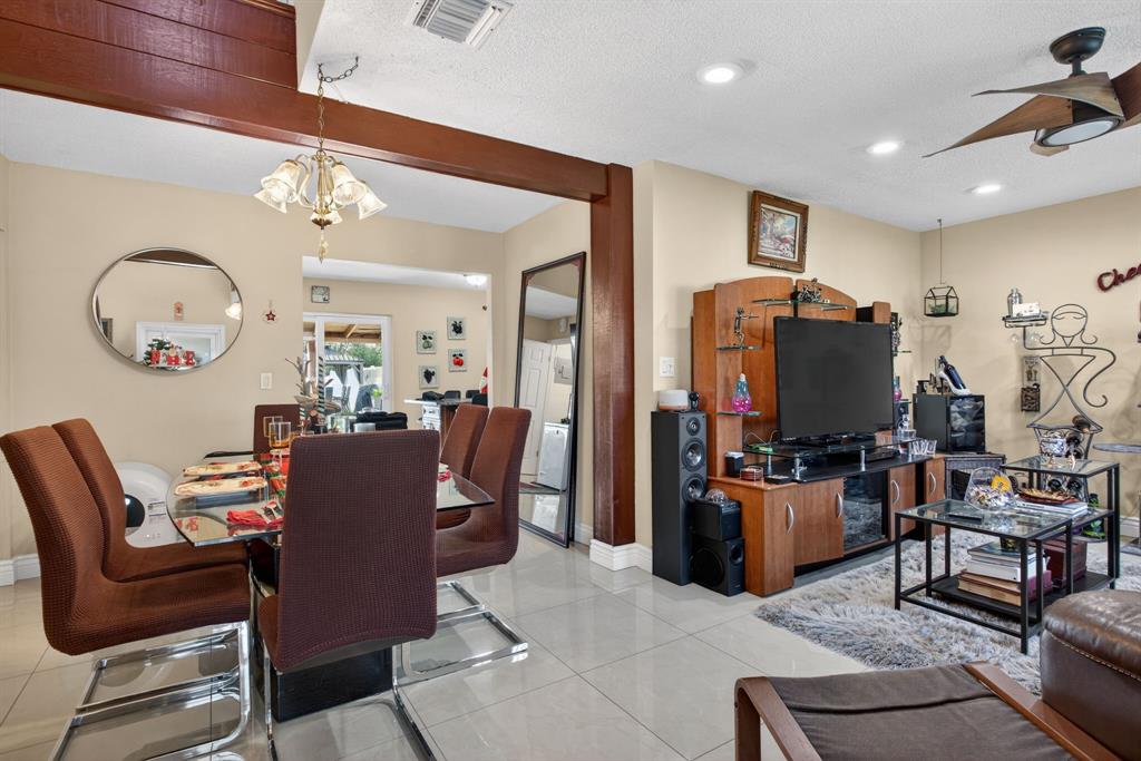 6224 Southwest 7th Street Margate, FL 33068 - Photo 23 of 51 a view of a livingroom with furniture and a flat screen tv