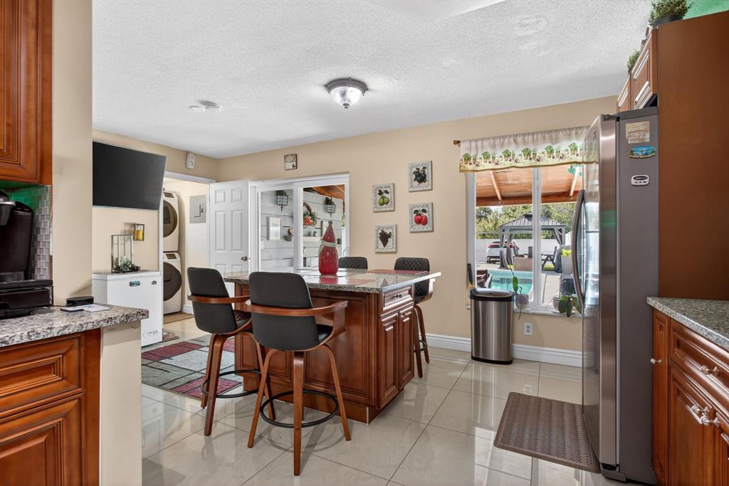 6224 Southwest 7th Street Margate, FL 33068 - Photo 33 of 51 a view of a dining room with furniture and a window
