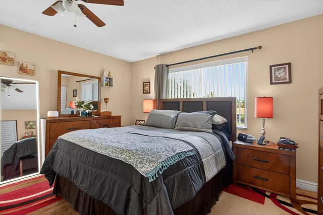 a bathroom with a sink vanity mirror and toilet