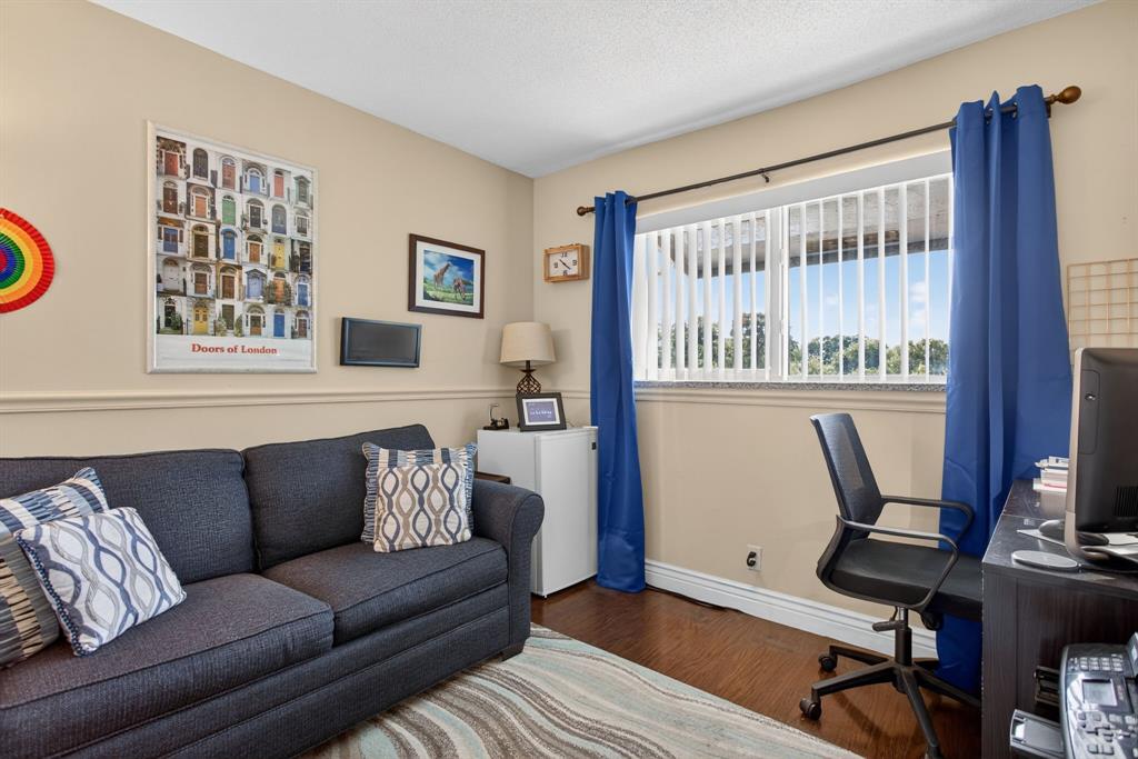6224 Southwest 7th Street Margate, FL 33068 - Photo 44 of 51 a living room with furniture a desk and chair with wooden floor