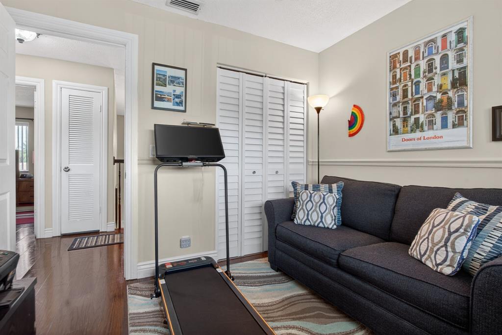 6224 Southwest 7th Street Margate, FL 33068 - Photo 45 of 51 a living room with furniture and a flat screen tv