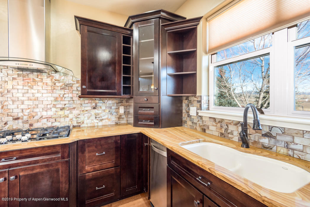 1317 East 17th Street Rifle, CO 81650 - Photo 13 of 57 a kitchen with a sink and a window