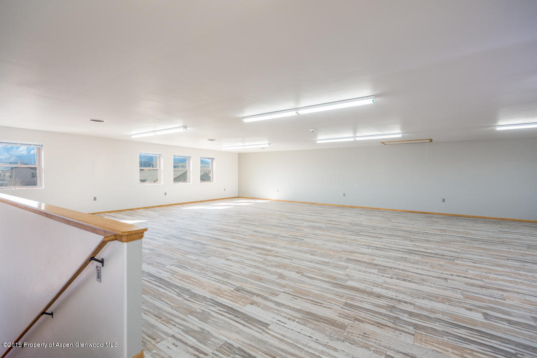 1317 East 17th Street Rifle, CO 81650 - Photo 39 of 57 a view of a room with wooden floor and stairs
