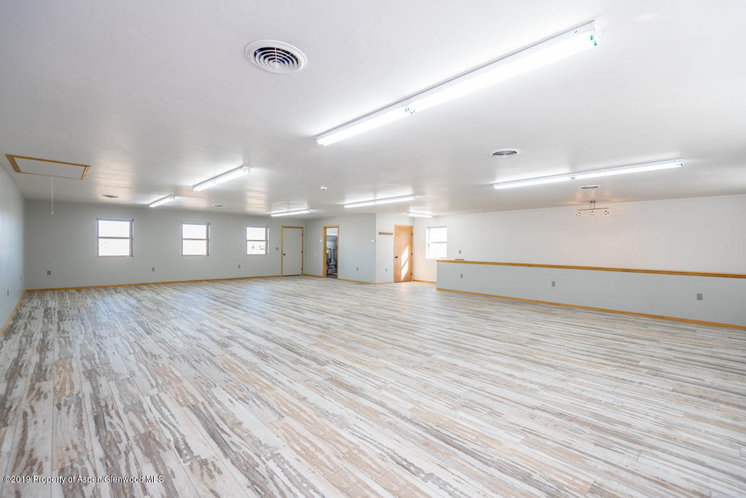 1317 East 17th Street Rifle, CO 81650 - Photo 40 of 57 a view of empty room with wooden floor
