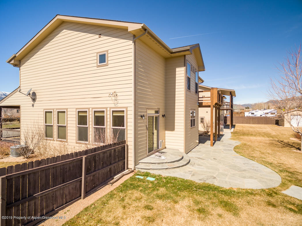 1317 East 17th Street Rifle, CO 81650 - Photo 49 of 57 a view of a house with a backyard