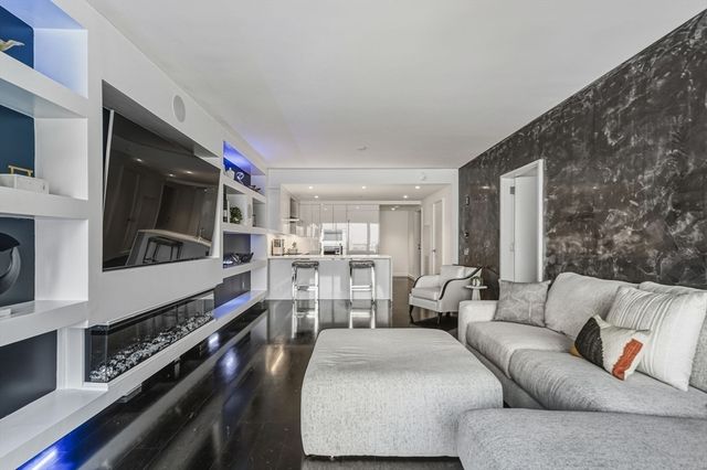a kitchen with stainless steel appliances granite countertop a stove and cabinets