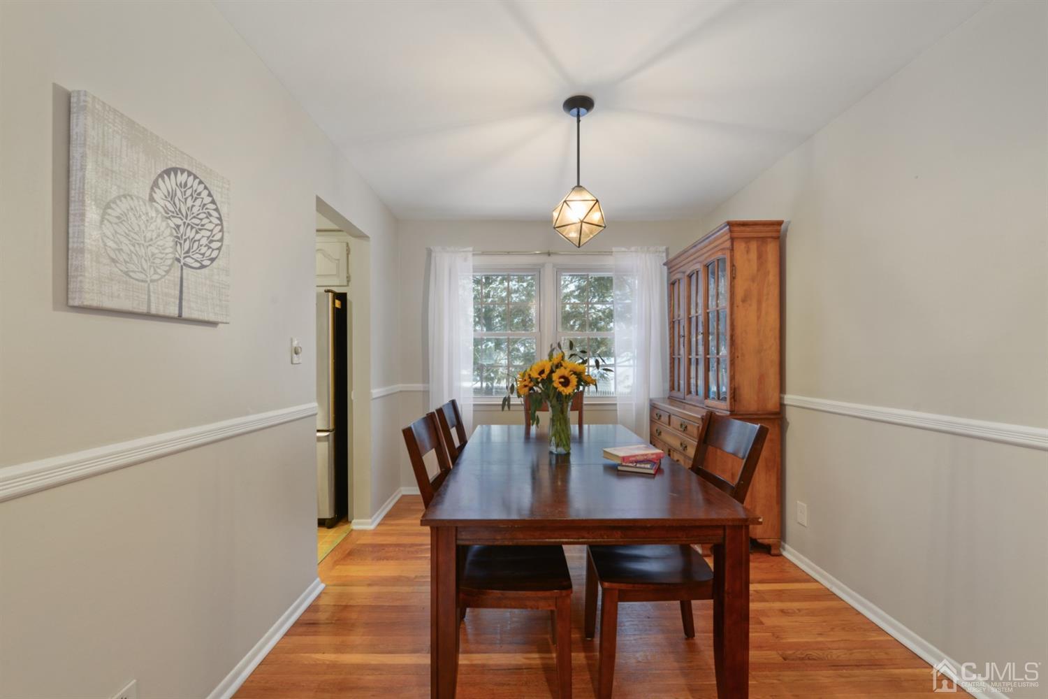 94 Vineyard Road Edison, NJ 08817 - Photo 14 of 30 a view of a dining room with furniture window and wooden floor