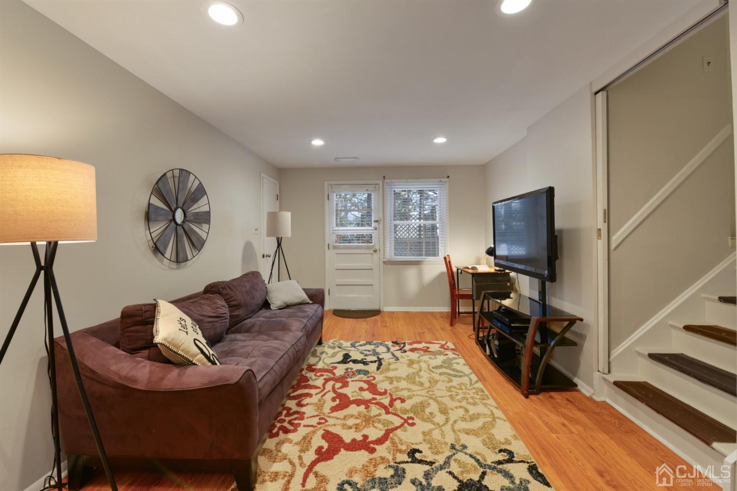 94 Vineyard Road Edison, NJ 08817 - Photo 8 of 30 a living room with furniture and a flat screen tv