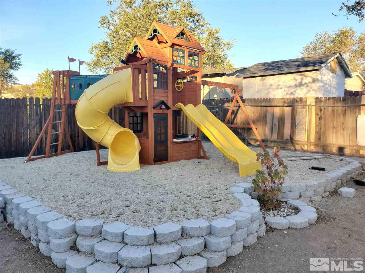 7610 Lytton Road Reno, NV 89506 - Photo 15 of 17 a view of a house with a backyard