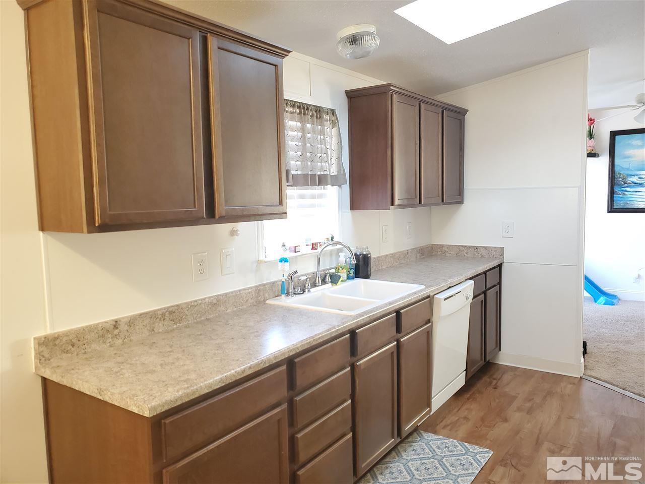 7610 Lytton Road Reno, NV 89506 - Photo 4 of 17 a bathroom with a sink and a mirror
