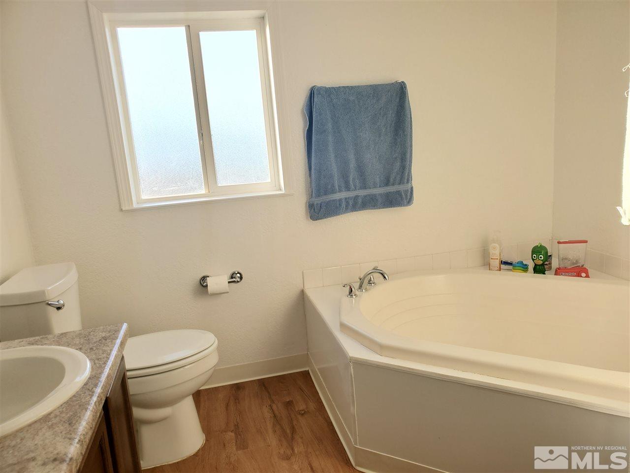 7610 Lytton Road Reno, NV 89506 - Photo 7 of 17 a bathroom with a sink and a toilet