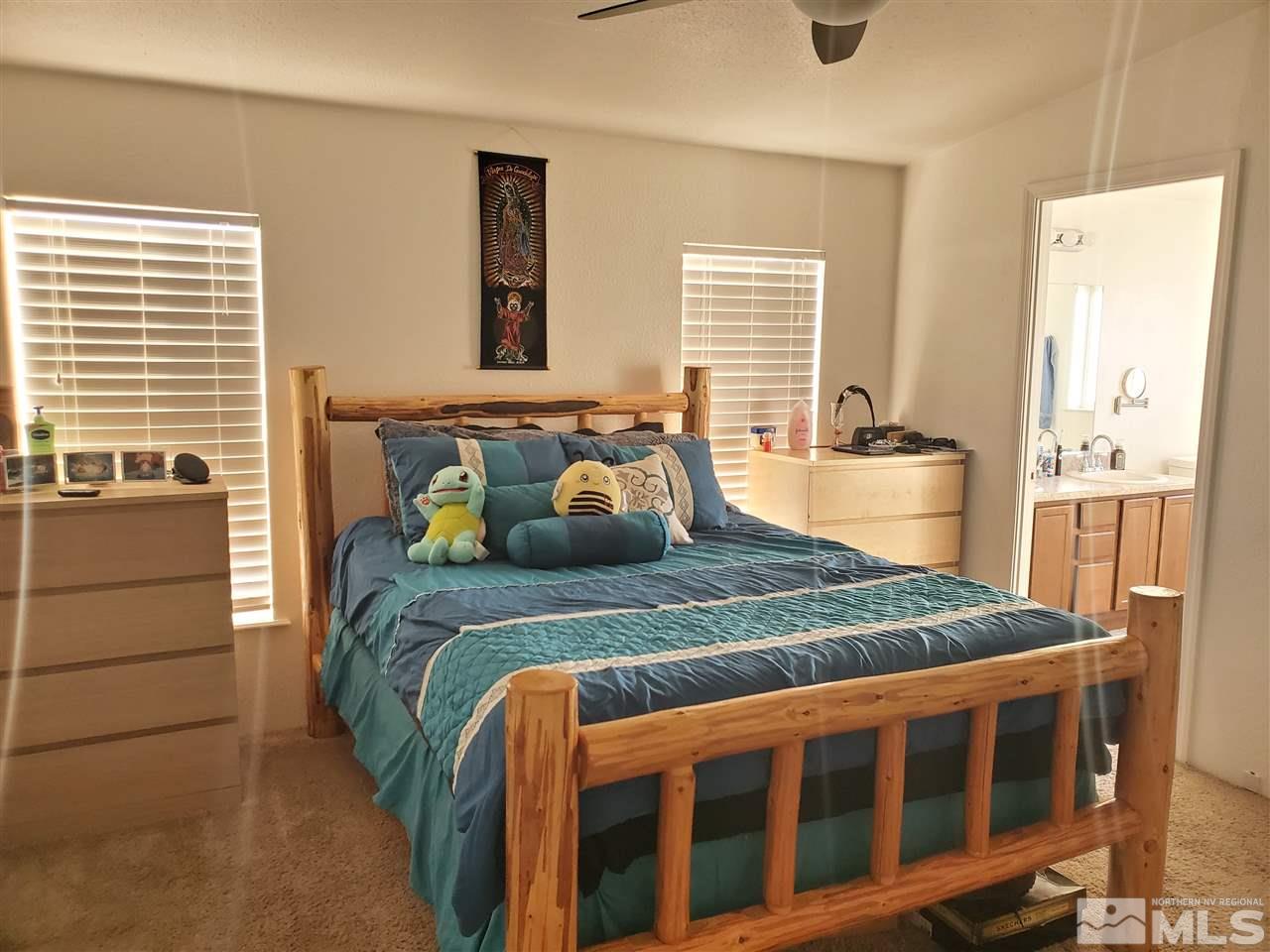 7610 Lytton Road Reno, NV 89506 - Photo 8 of 17 a bedroom with a bed and a window