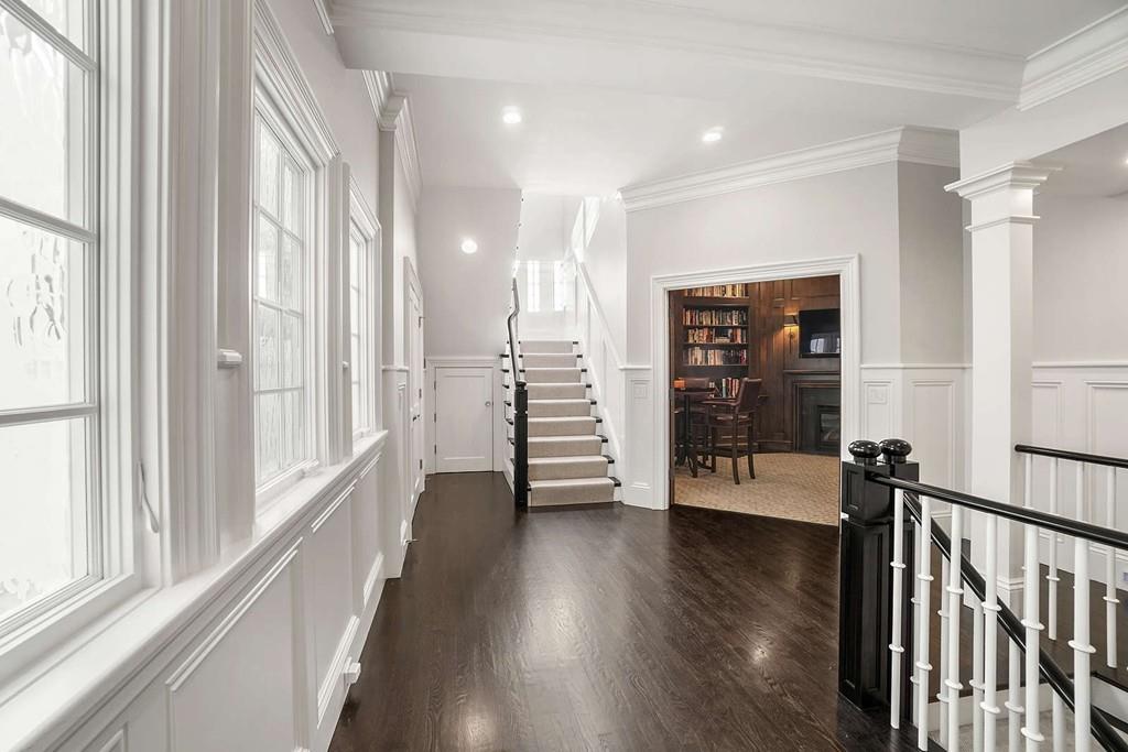 33 Beaver Place Boston, MA 02108 - Photo 12 of 22 a view of a hallway with wooden floor and stairs