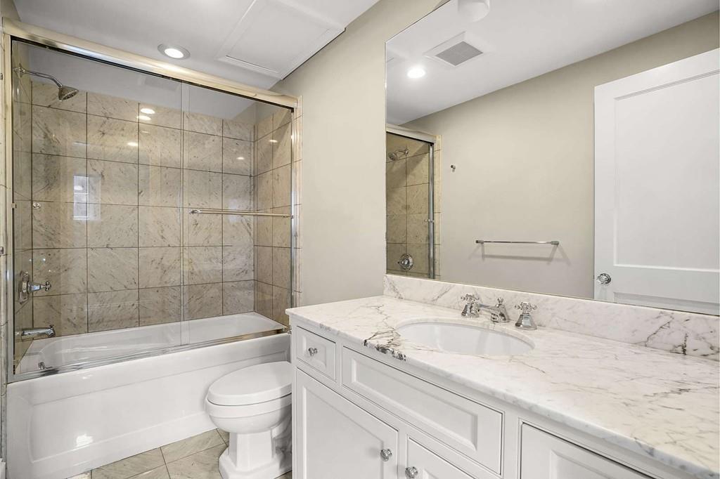 33 Beaver Place Boston, MA 02108 - Photo 19 of 22 a bathroom with a granite countertop sink a toilet and bathtub