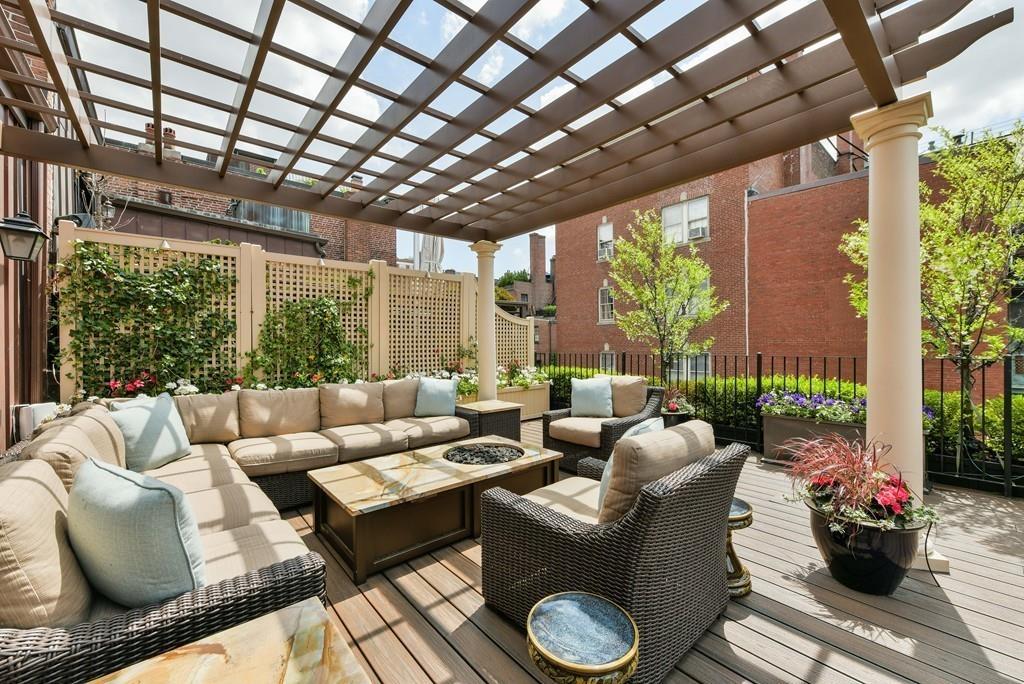 33 Beaver Place Boston, MA 02108 - Photo 20 of 22 a living room with furniture and a large window