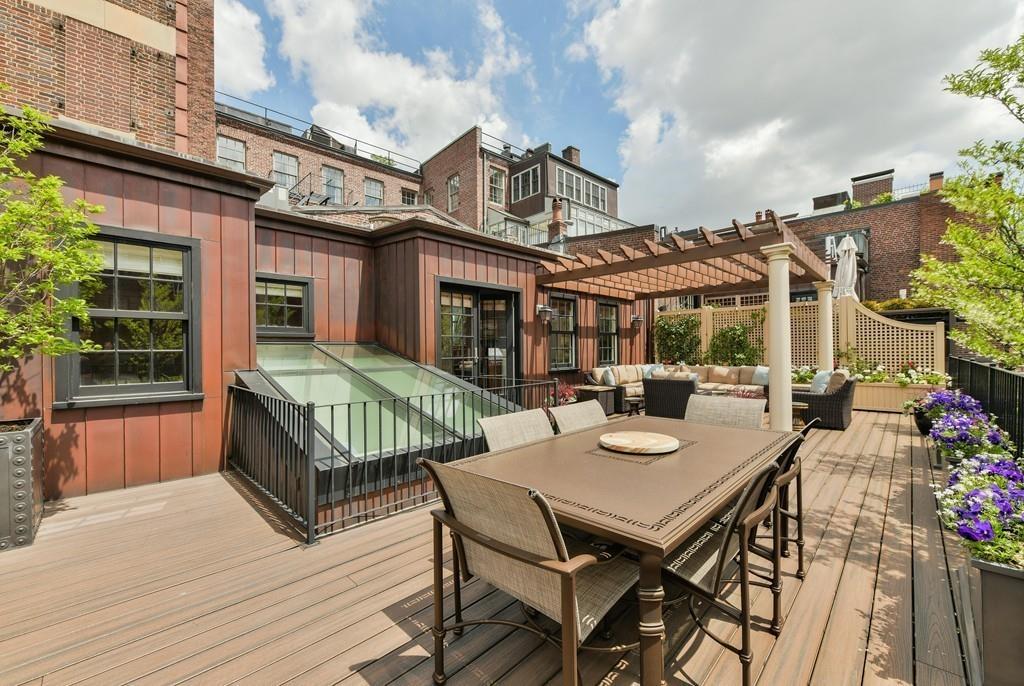 33 Beaver Place Boston, MA 02108 - Photo 22 of 22 a view of a patio with furniture and a wooden floor