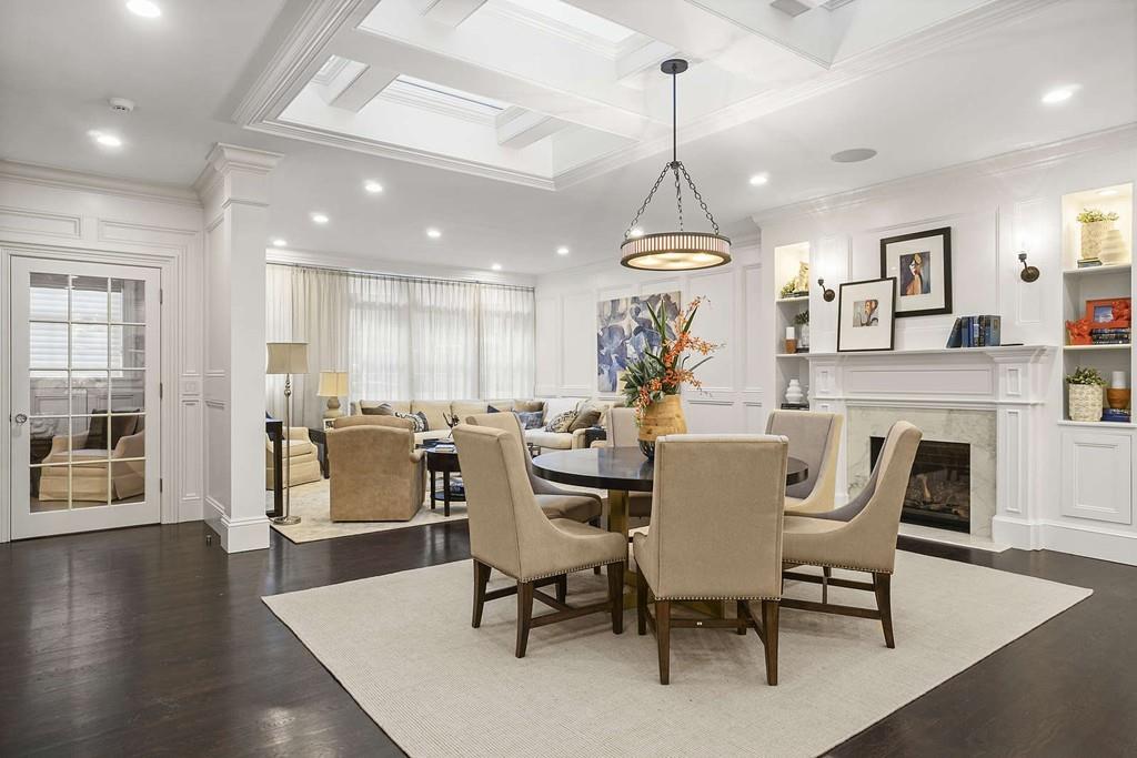 33 Beaver Place Boston, MA 02108 - Photo 3 of 22 a dining room with furniture a chandelier and wooden floor