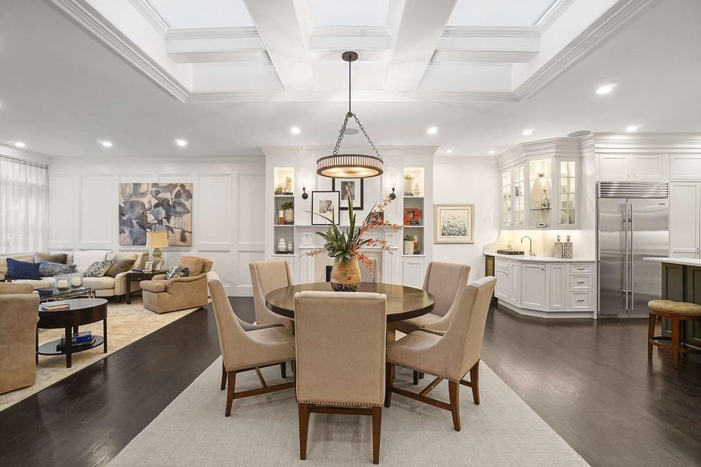 33 Beaver Place Boston, MA 02108 - Photo 4 of 22 a view of a dining room and livingroom with furniture wooden floor a chandelier