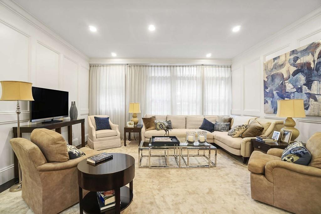 33 Beaver Place Boston, MA 02108 - Photo 5 of 22 a living room with furniture and a flat screen tv