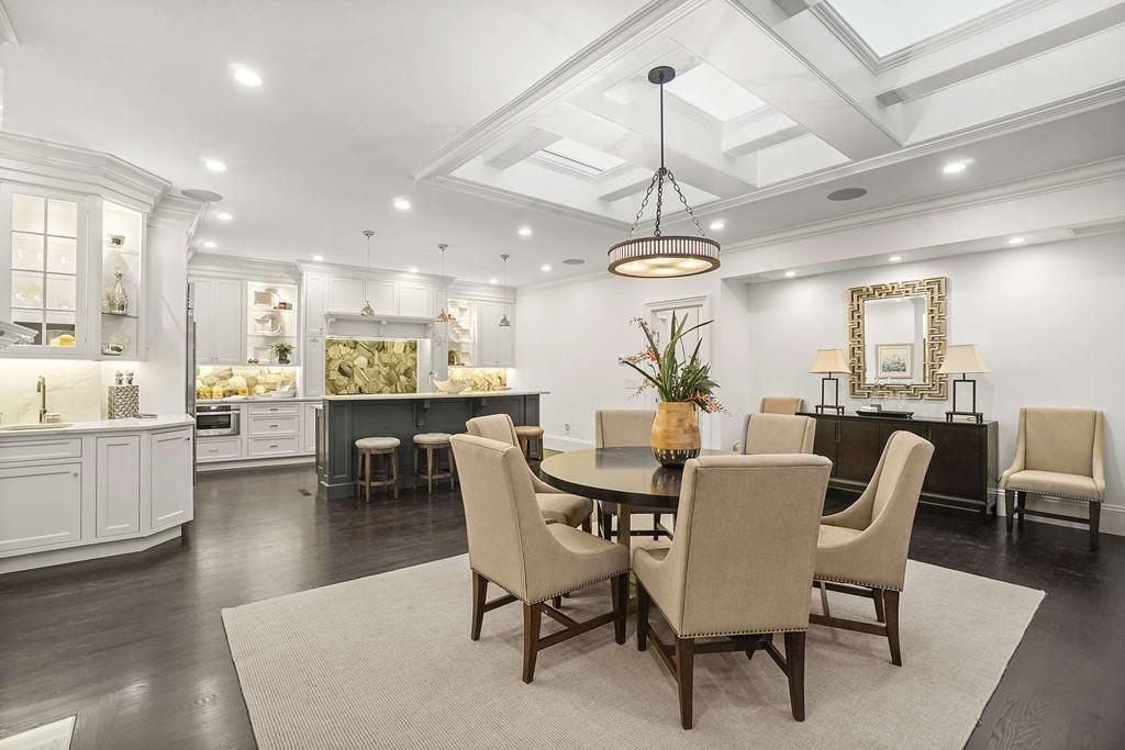 33 Beaver Place Boston, MA 02108 - Photo 6 of 22 a view of a dining room and livingroom with furniture wooden floor a chandelier