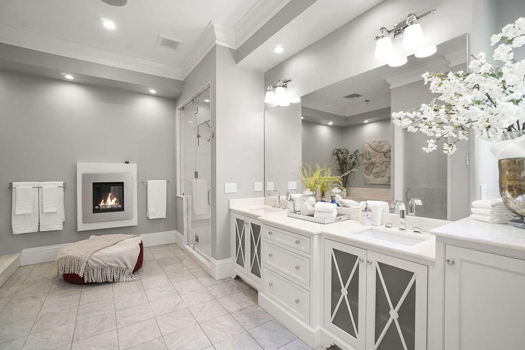 33 Beaver Place Boston, MA 02108 - Photo 10 of 22 a spacious bathroom with a double vanity sink a mirror and a bathtub