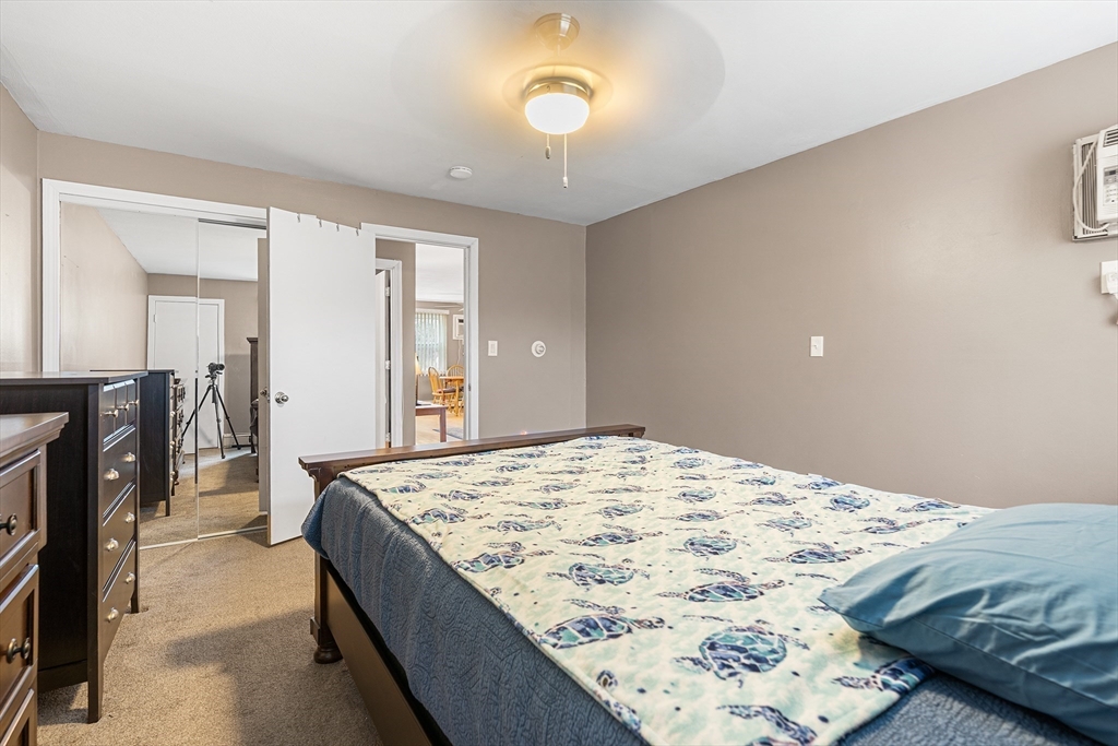 17 Powderhouse Court, Unit 17 Amesbury, MA 01913 - Photo 11 of 13 a bedroom with a bed and a dresser