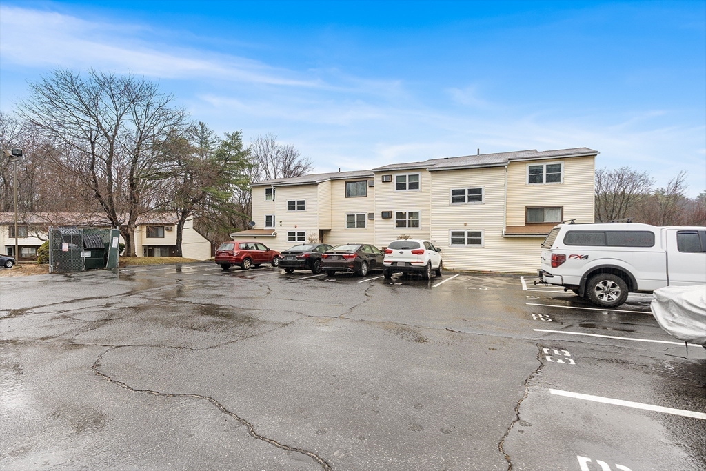 17 Powderhouse Court, Unit 17 Amesbury, MA 01913 - Photo 12 of 13 a view of a cars park in front of house