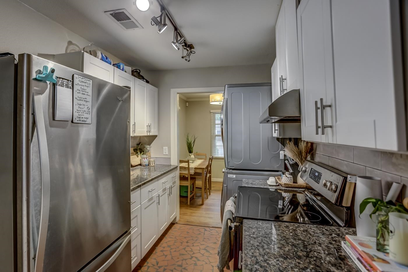 4464 Helene Road Memphis, TN 38117 - Photo 12 of 27 a kitchen with refrigerator a sink and a stove