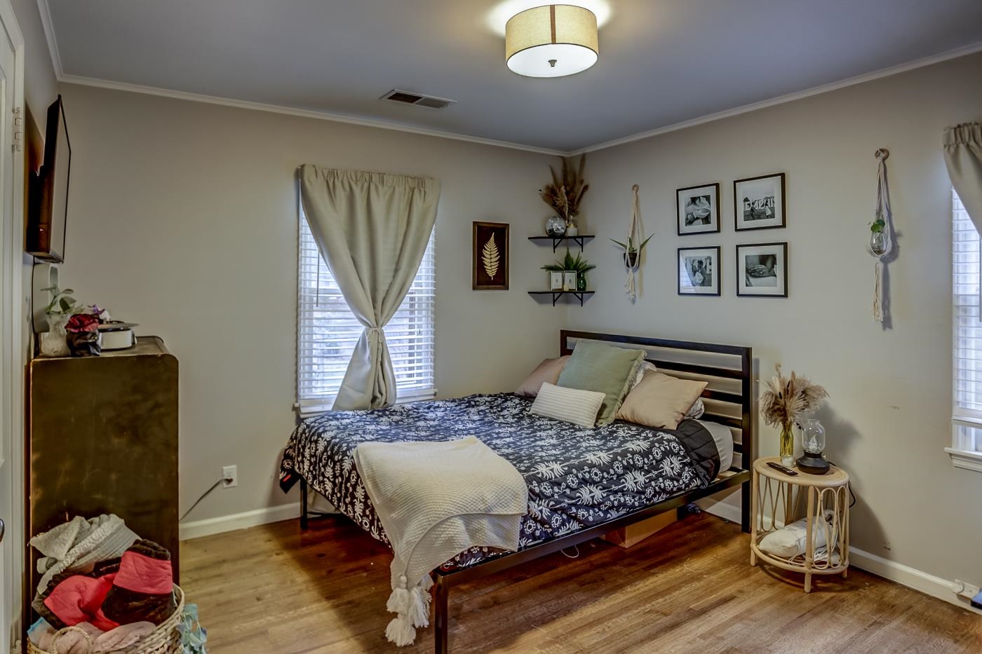 4464 Helene Road Memphis, TN 38117 - Photo 18 of 27 a bedroom with a bed and wooden floor