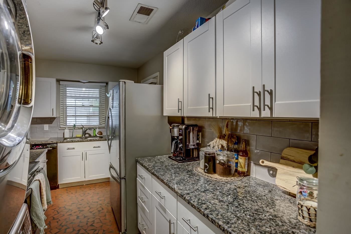4464 Helene Road Memphis, TN 38117 - Photo 10 of 27 a kitchen with granite countertop cabinets stainless steel appliances a sink and a counter top space