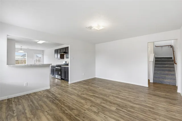 a view of kitchen and wooden floor