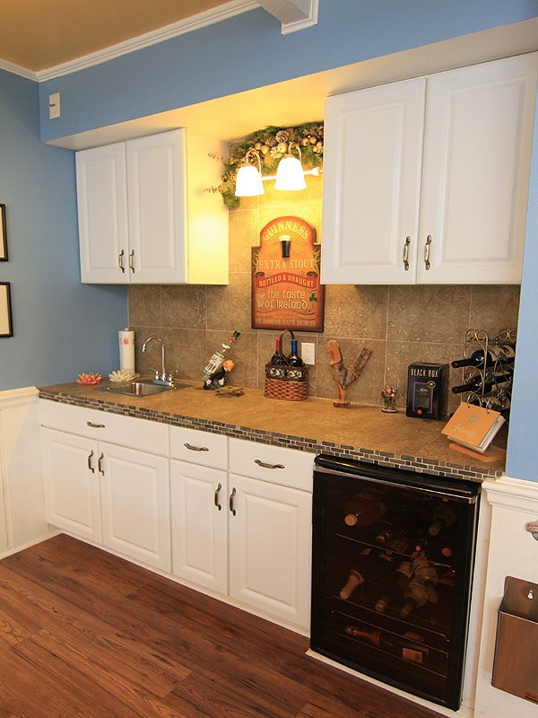 5328 Edington Lane Raleigh, NC 27604 - Photo 9 of 25 Conveniently located wet bar in the family room with wine cooler, tile backsplash and ample cabinets. Family Room