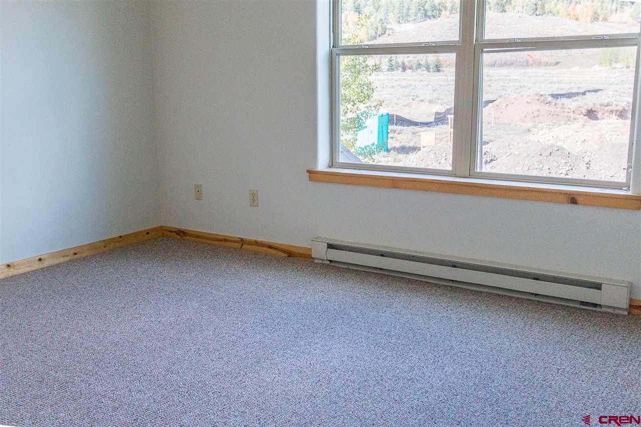 25 Elk Valley Road, Unit 102 Crested Butte, CO 81224 - Photo 6 of 12 an empty room with a window