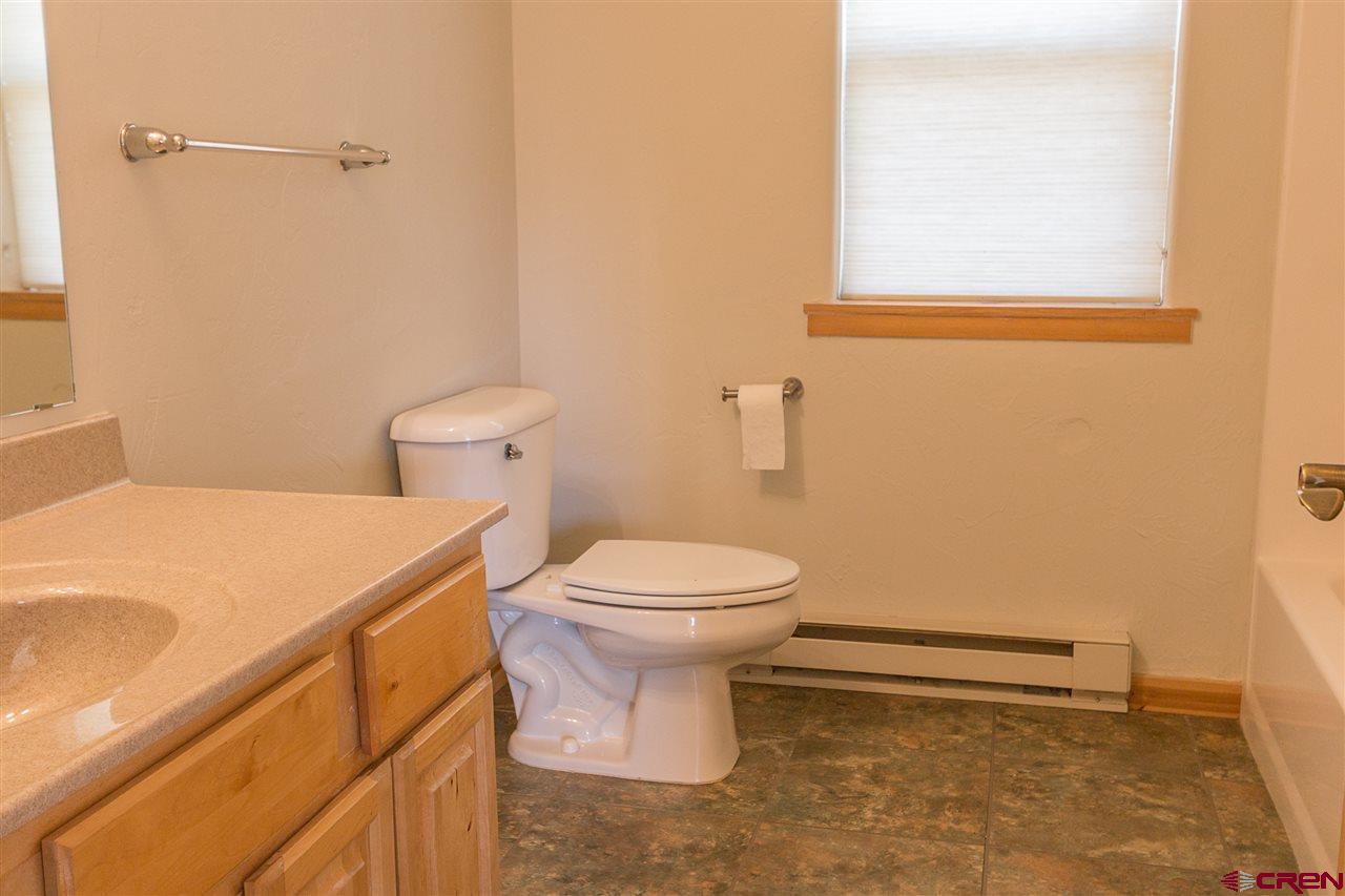 25 Elk Valley Road, Unit 102 Crested Butte, CO 81224 - Photo 8 of 12 a bathroom with a toilet and a sink