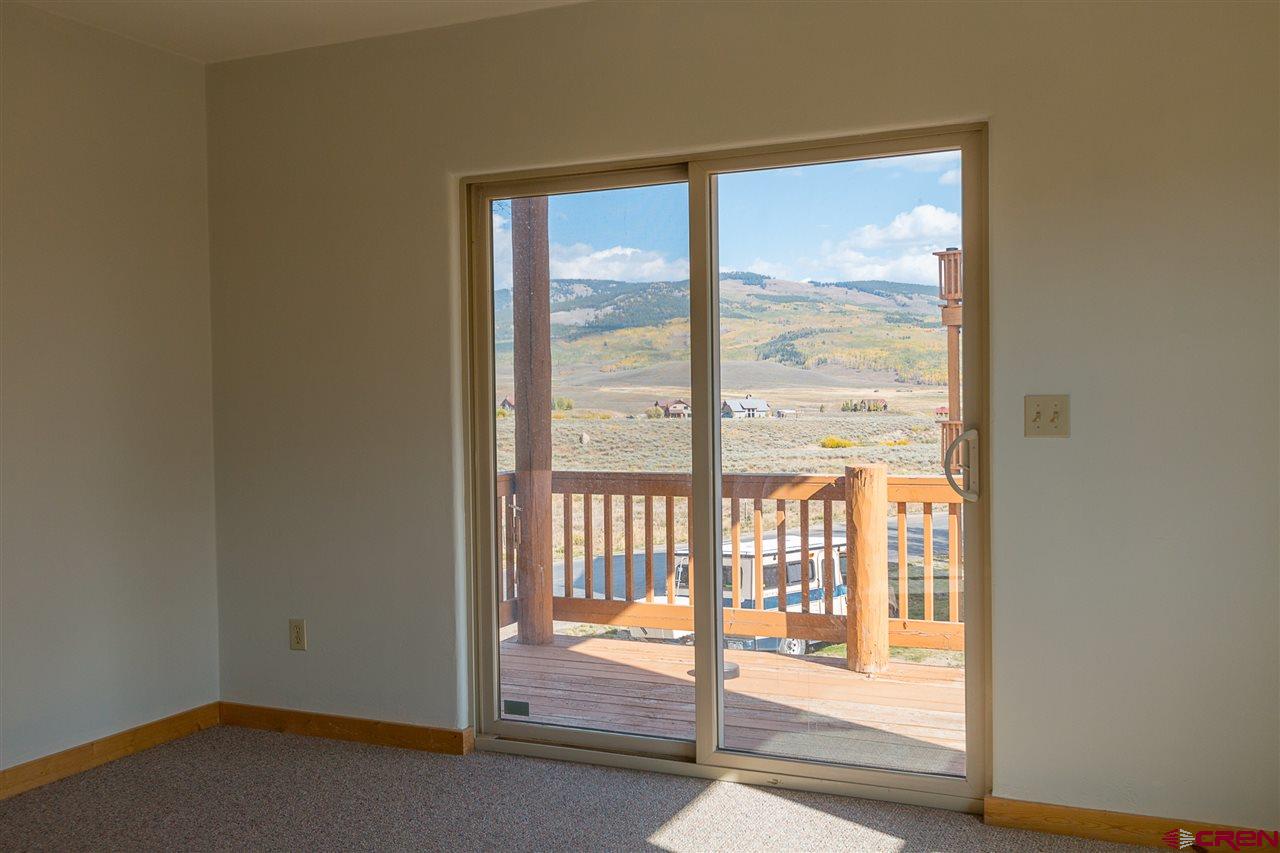 25 Elk Valley Road, Unit 102 Crested Butte, CO 81224 - Photo 9 of 12 a view of an empty room and window