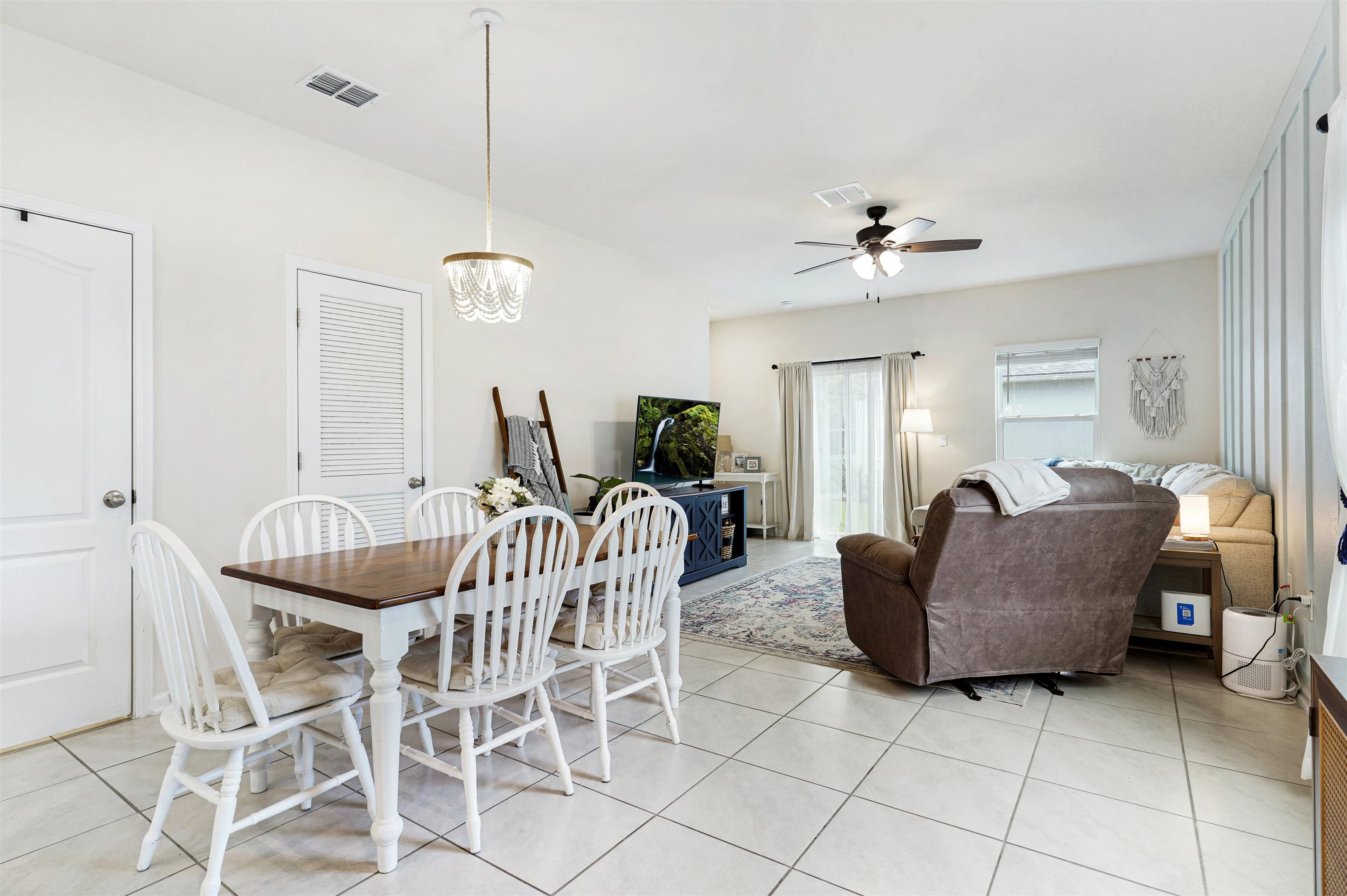 135 Pomona Way St. Augustine, FL 32095 - Photo 12 of 33 a living room with furniture and a chandelier