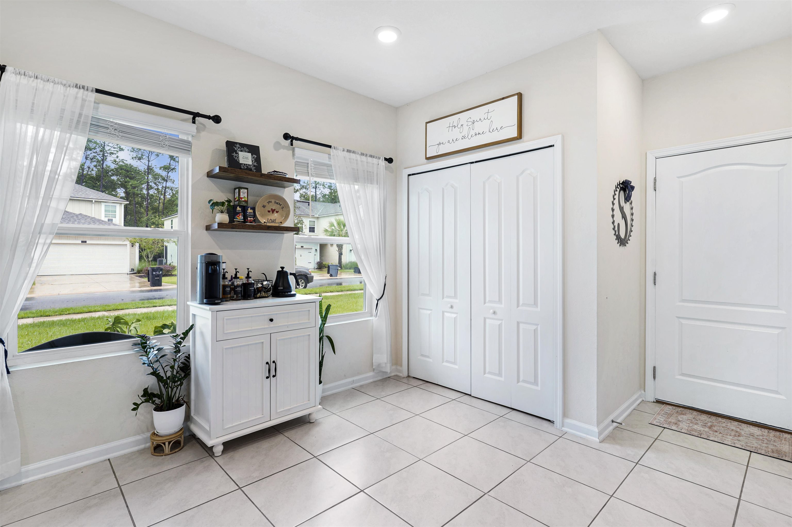 135 Pomona Way St. Augustine, FL 32095 - Photo 14 of 33 a kitchen with white cabinets and window