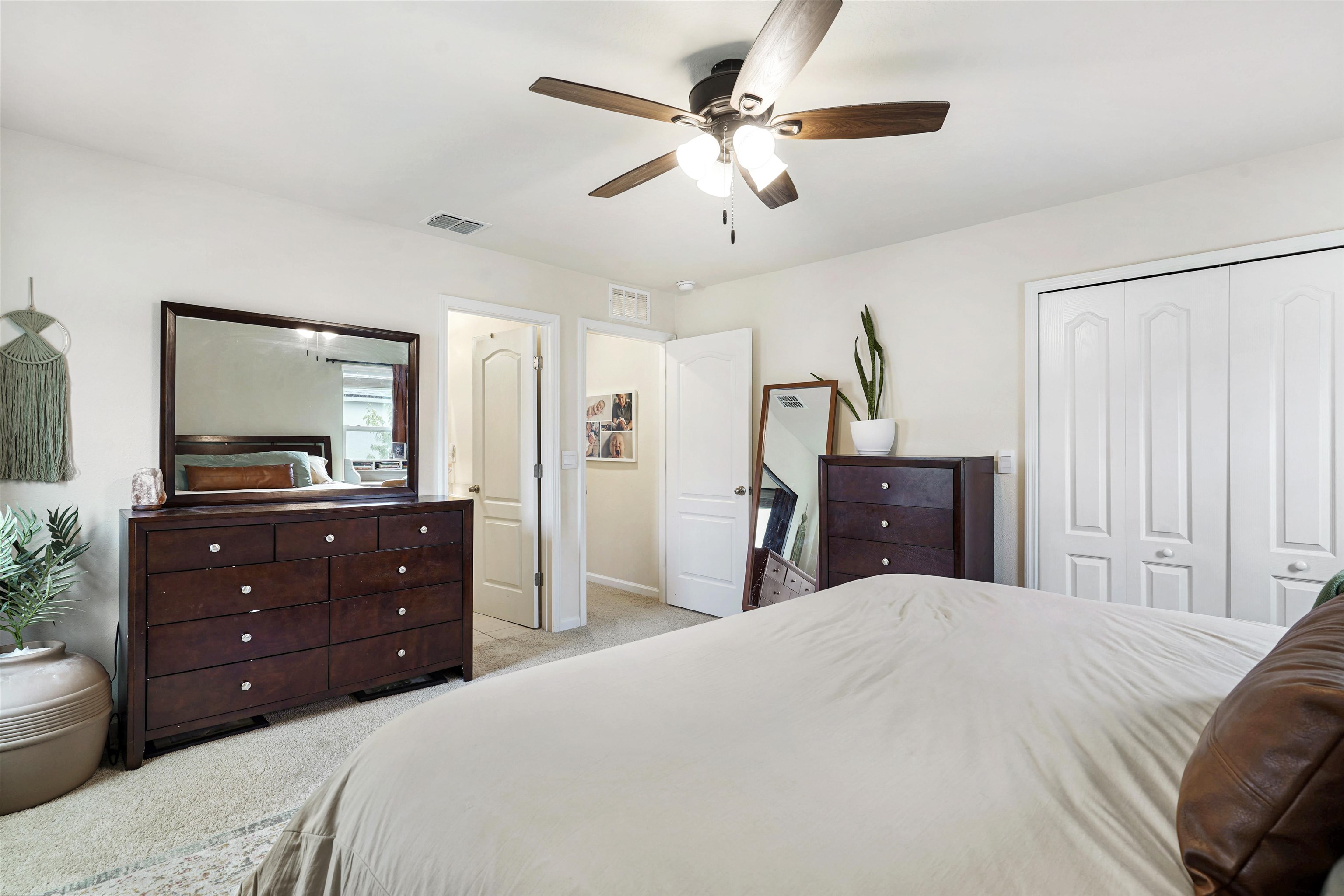135 Pomona Way St. Augustine, FL 32095 - Photo 15 of 33 a bedroom with a bed and a mirror on dresser