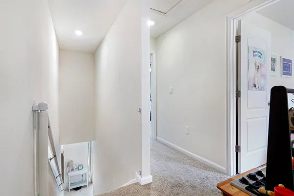 a view of a hallway with windows