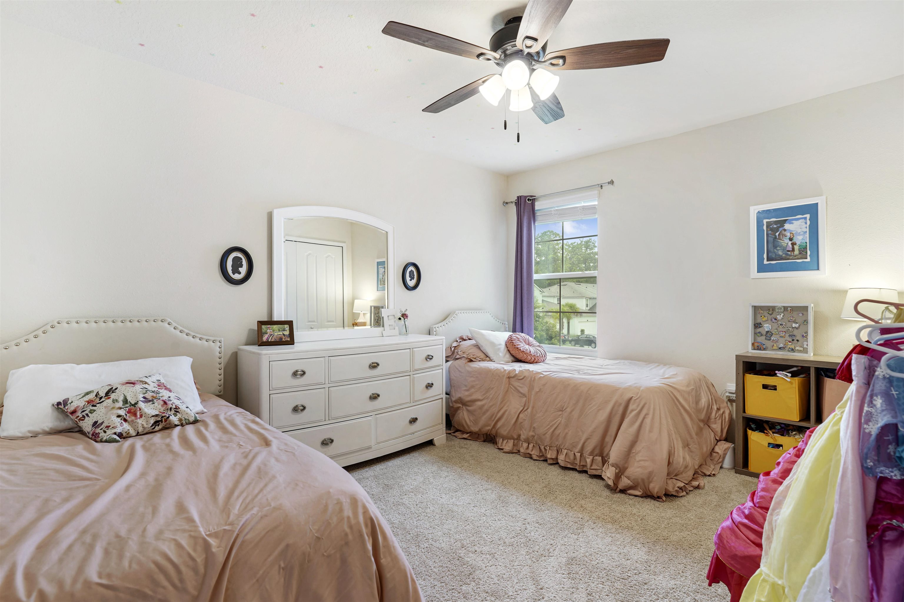 135 Pomona Way St. Augustine, FL 32095 - Photo 20 of 33 a bedroom with a bed and a chandelier