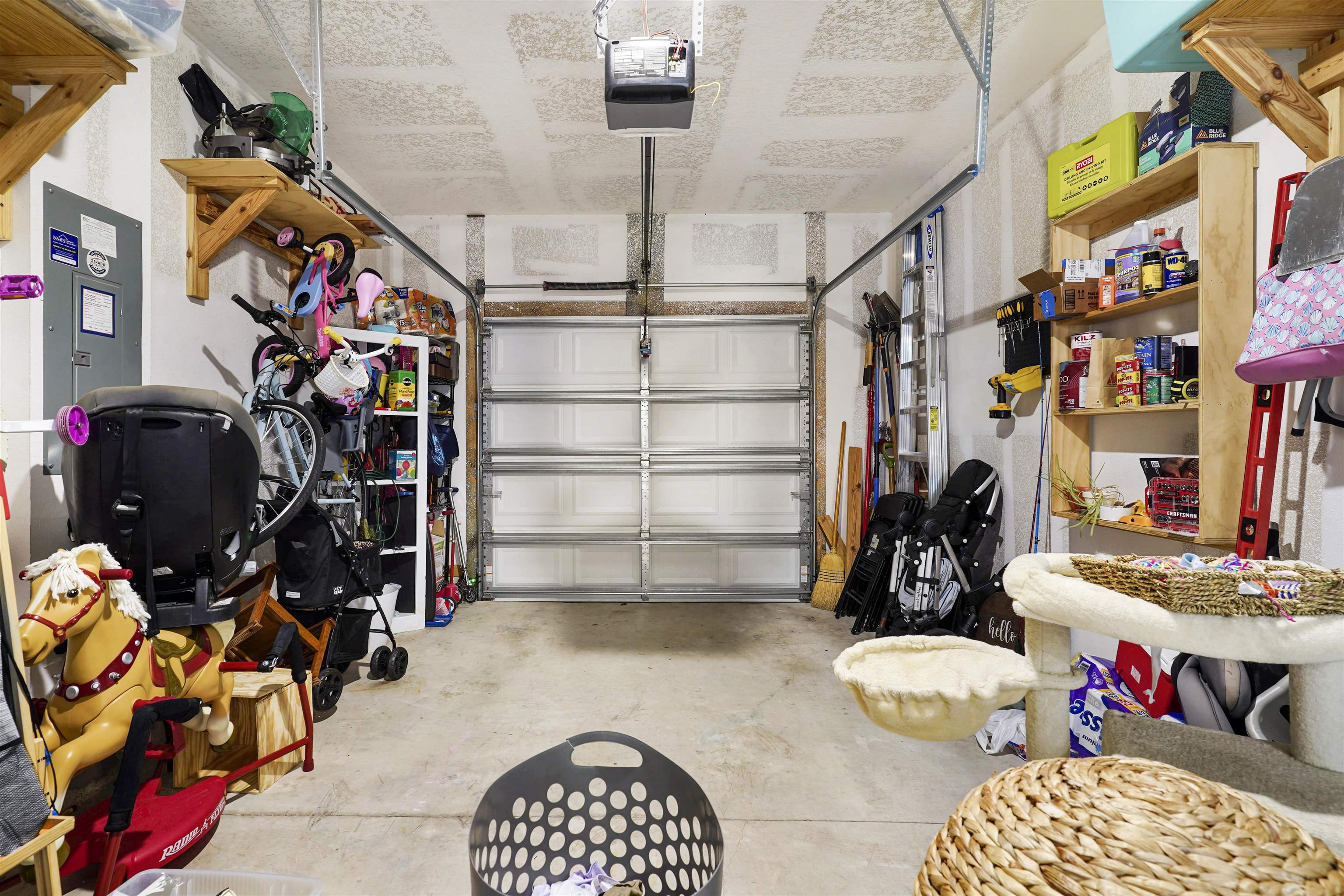 135 Pomona Way St. Augustine, FL 32095 - Photo 26 of 33 a view of walk in closet with clothes and shoes