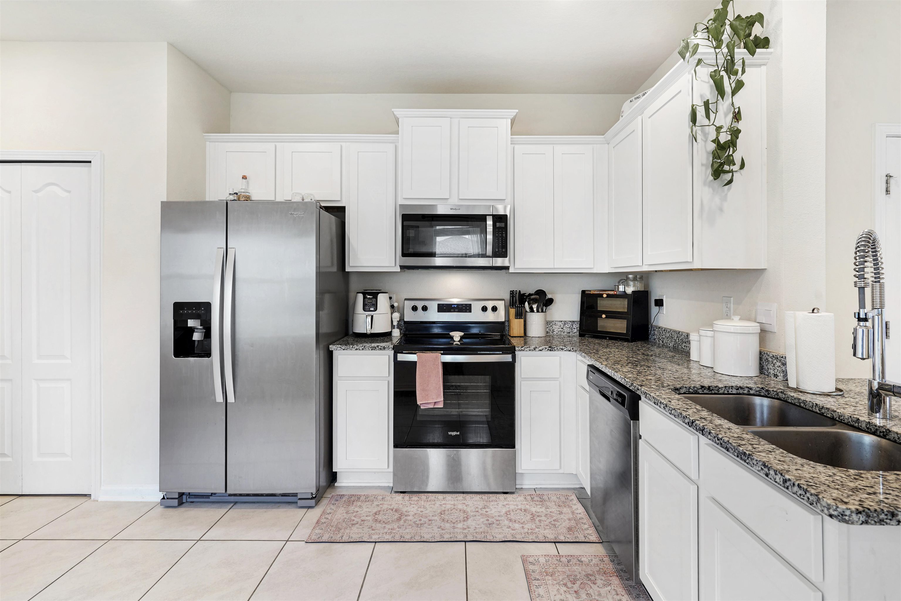 135 Pomona Way St. Augustine, FL 32095 - Photo 4 of 33 a kitchen with granite countertop a refrigerator and a sink
