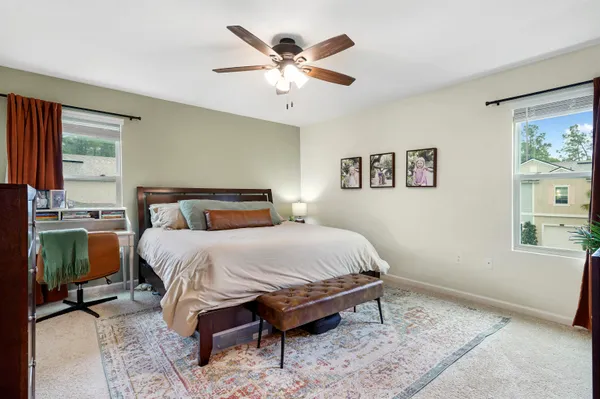 a bedroom with a bed and window
