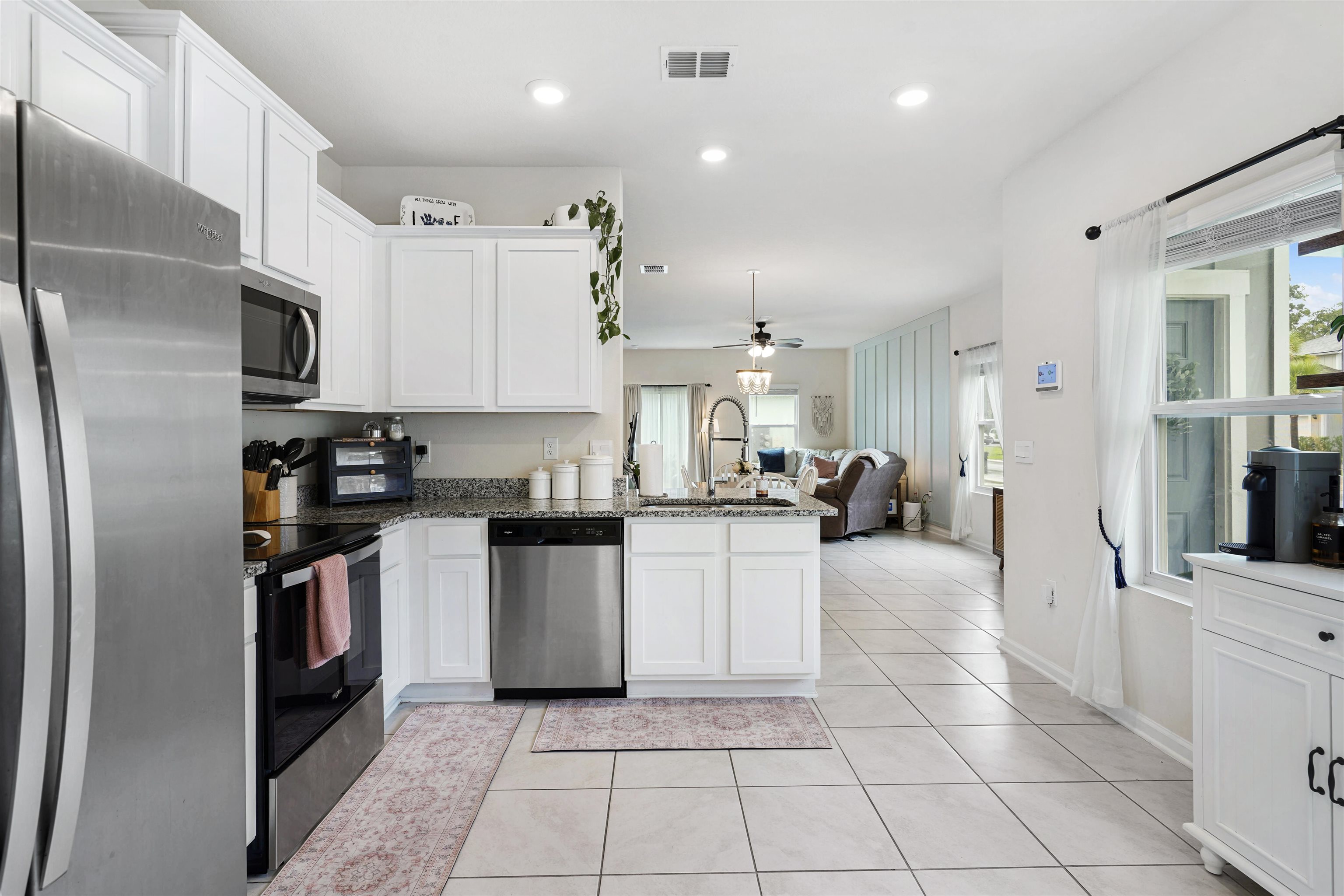 135 Pomona Way St. Augustine, FL 32095 - Photo 10 of 33 a kitchen with stainless steel appliances granite countertop a refrigerator and a sink