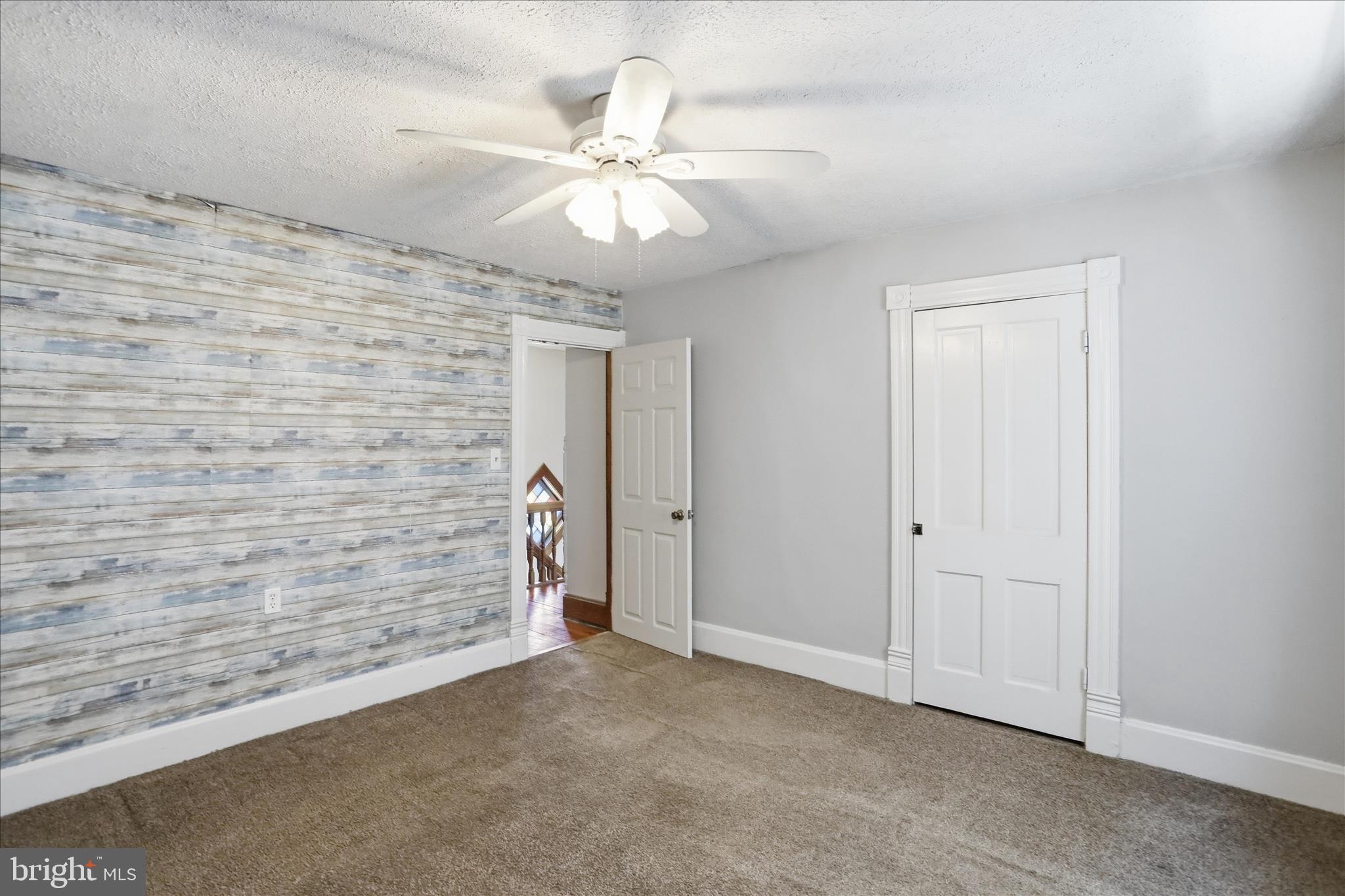 21 Sharpless Street Keyser, WV 26726 - Photo 21 of 33 en empty room with fan and fan